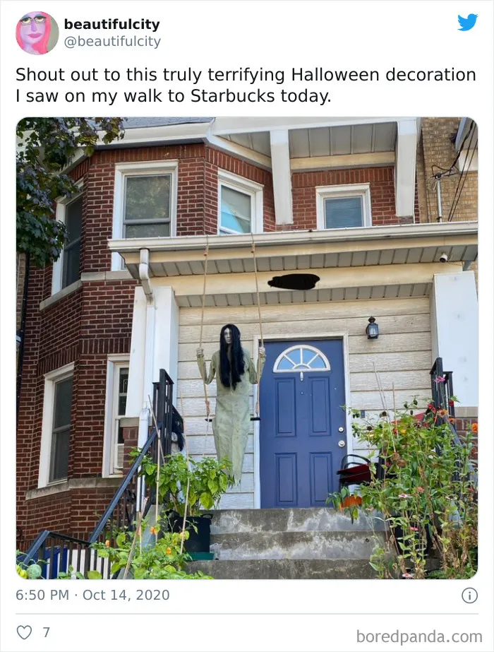 Terrifying Halloween decoration with a creepy figure hanging on a swing in front of a residential house in 2020.