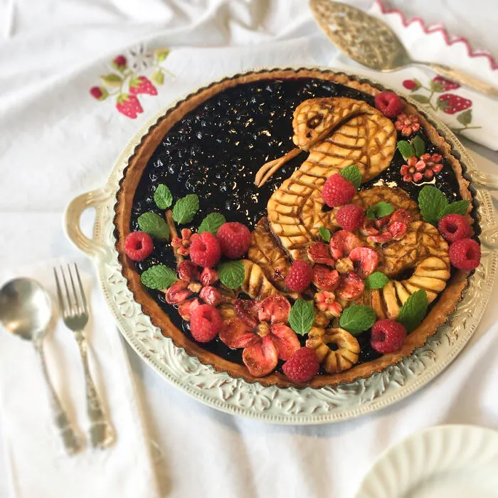 Blueberry Pie With Strawberry Flowers And Raspberries