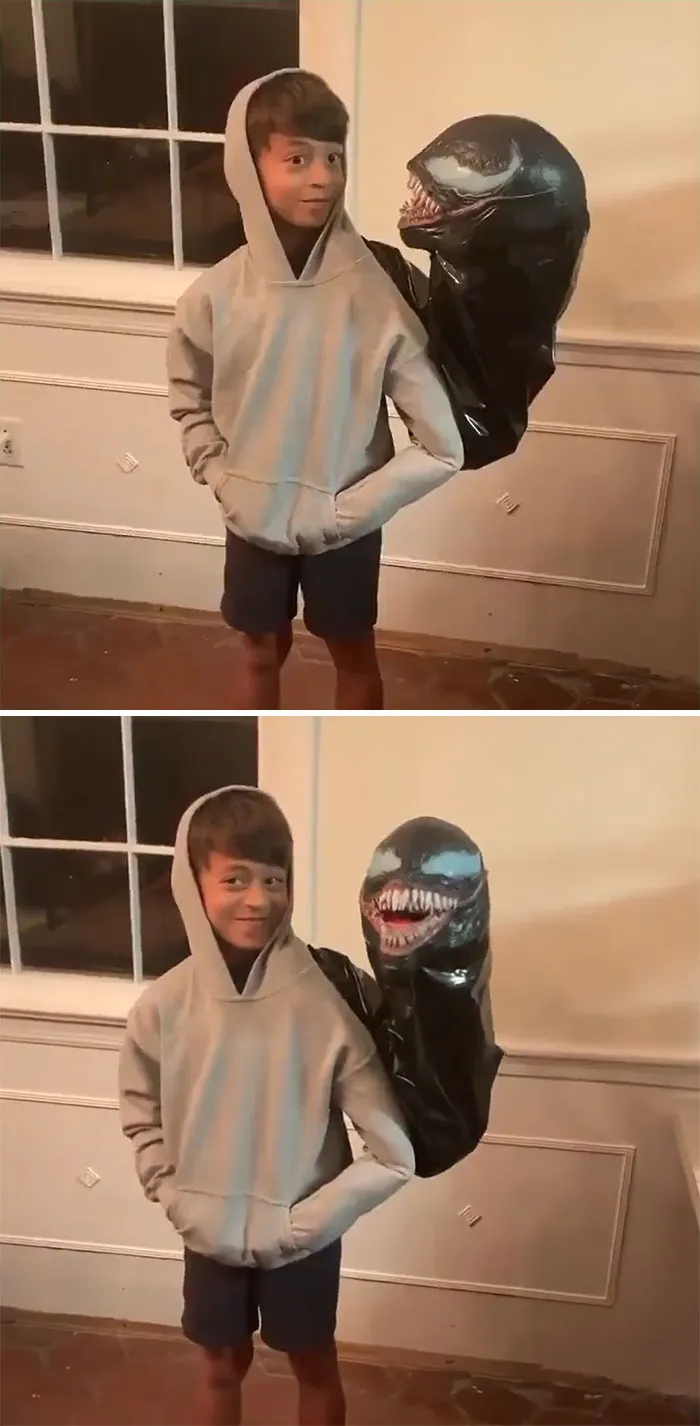A young boy posing in a clever Venom Halloween costume showing the alien symbiote over his shoulder.
