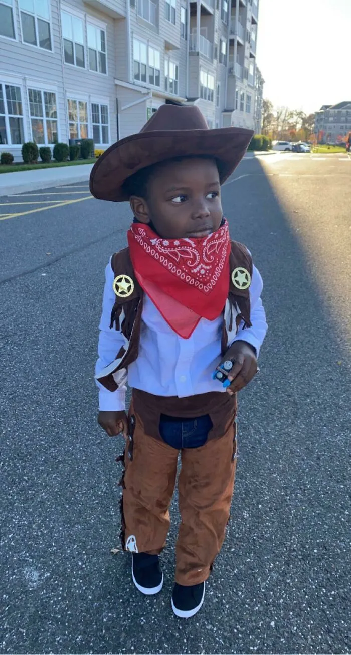 Young boy dressed as a sheriff cowboy for fun Halloween costumes