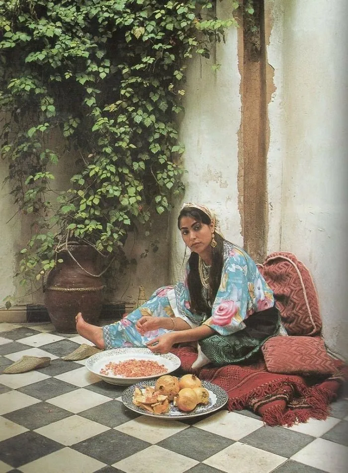 This Lady Peeling Pomegranates
