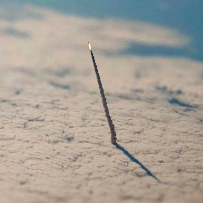 A Sewing Needle Going Through A Cotton Sheet