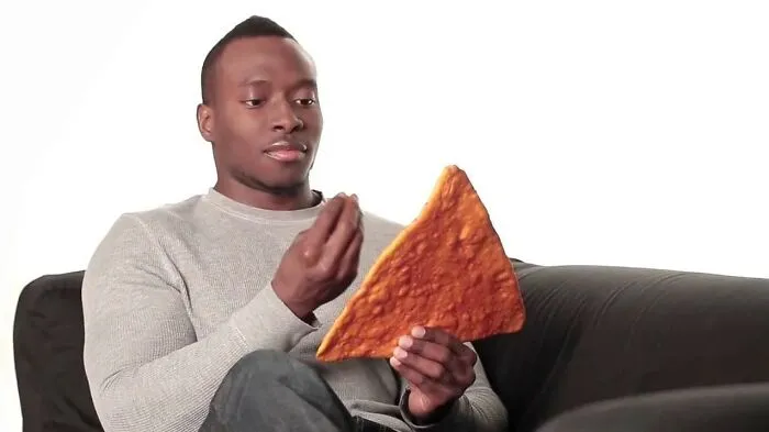 An Italian Having A Conversation With A Giant Nacho