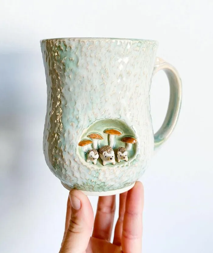 These 31 Brilliant Mugs Have Small Side Nooks Where Tiny Animal Sculptures Live