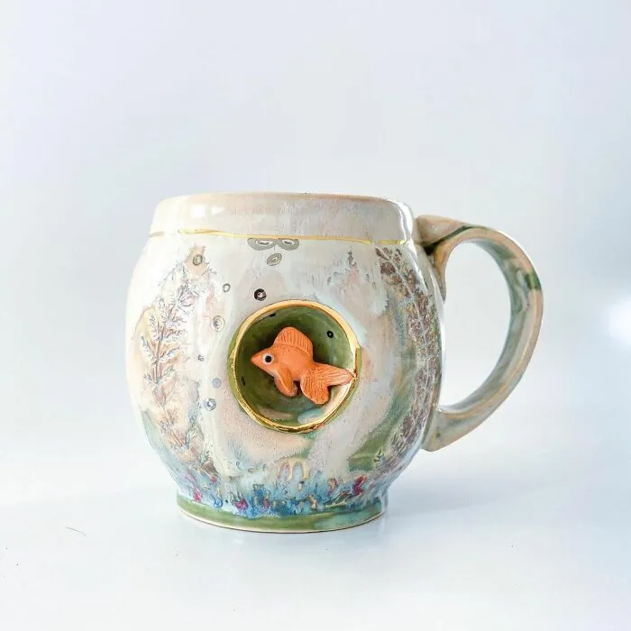 These 31 Brilliant Mugs Have Small Side Nooks Where Tiny Animal Sculptures Live