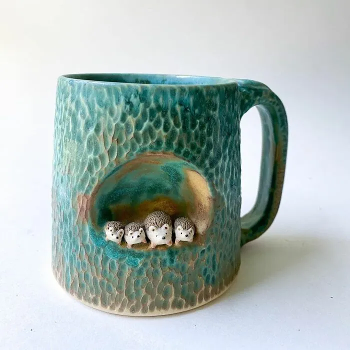These 31 Brilliant Mugs Have Small Side Nooks Where Tiny Animal Sculptures Live