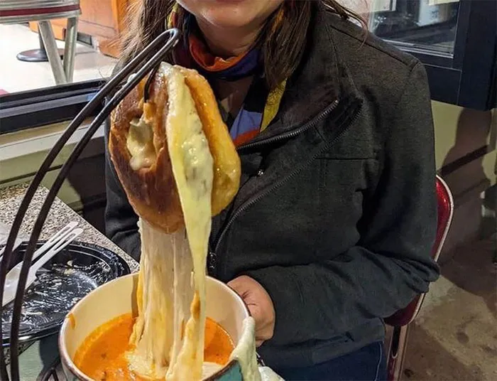 Yes That Is A Bagel Filled With Cheese Mounted Like A Deer Over A Bowel Of Tomato Soup