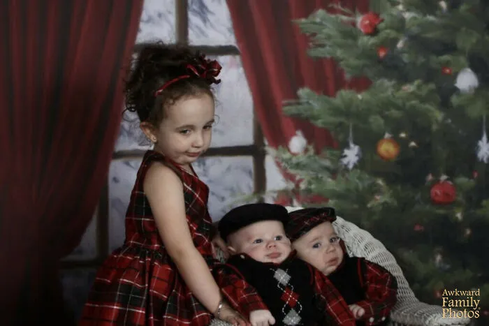 My Sister And I Thought It Might Be A Good Idea To Have Our Kids’ Photos Taken As A Christmas Present For My Mom.  With Two Hungry, Tired Newborn Babies And A Bored 3 Year Old, It Was Quite Possibly The Worst Day Of Our Lives.  This Was The Best Pic We Could Get Of All Three Of Them