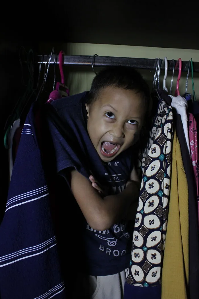 A Boy Hung On Clothes Hangers