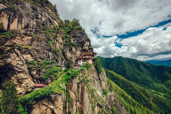 Taktsang Palphug Monastery More Famous As Paro Taktsang Is A Buddhist Temple Complex Which Clings To A Cliff, 3120 Meters Above The Sea Level On The Side Of The Upper Paro Valley, Bhutan.