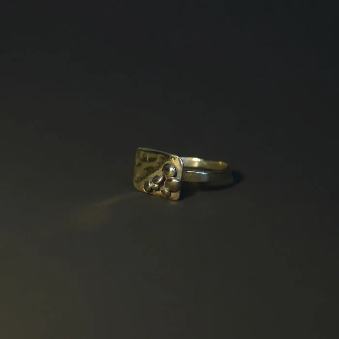 Asymmetrical Ring Decorated With Brass "Stones"