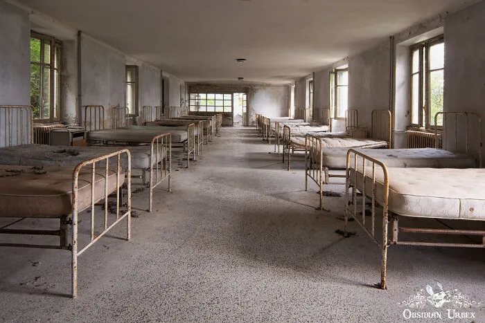 A Children's Dormitory Inside An Abandoned Sanatorium. In The Years Before Antibiotics, Sunlight And Fresh Air Was Used To Treat Patients With Many Respiratory Diseases Including Tuberculosis.