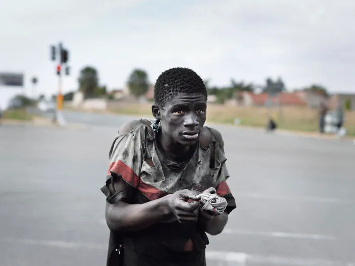 At A Traffic Intersection, Johannesburg, 2011, "Kin"