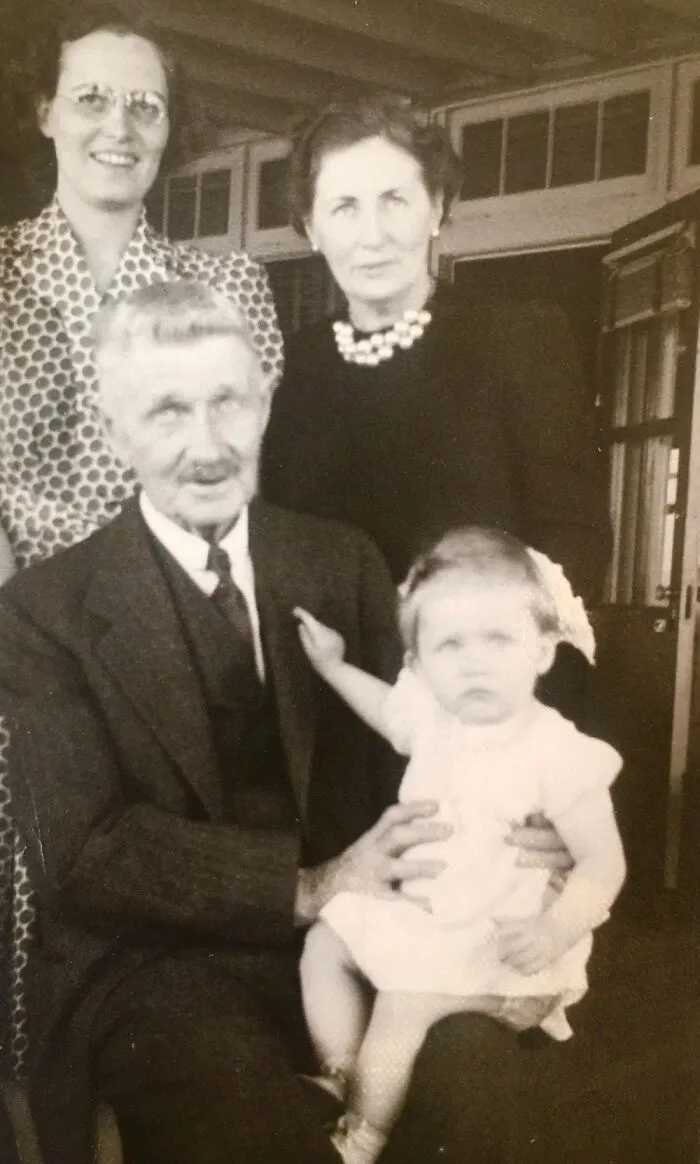 Great Grandfather Holding My Mom. My Grandmother Behind Him And Great Grandmother With Pearls