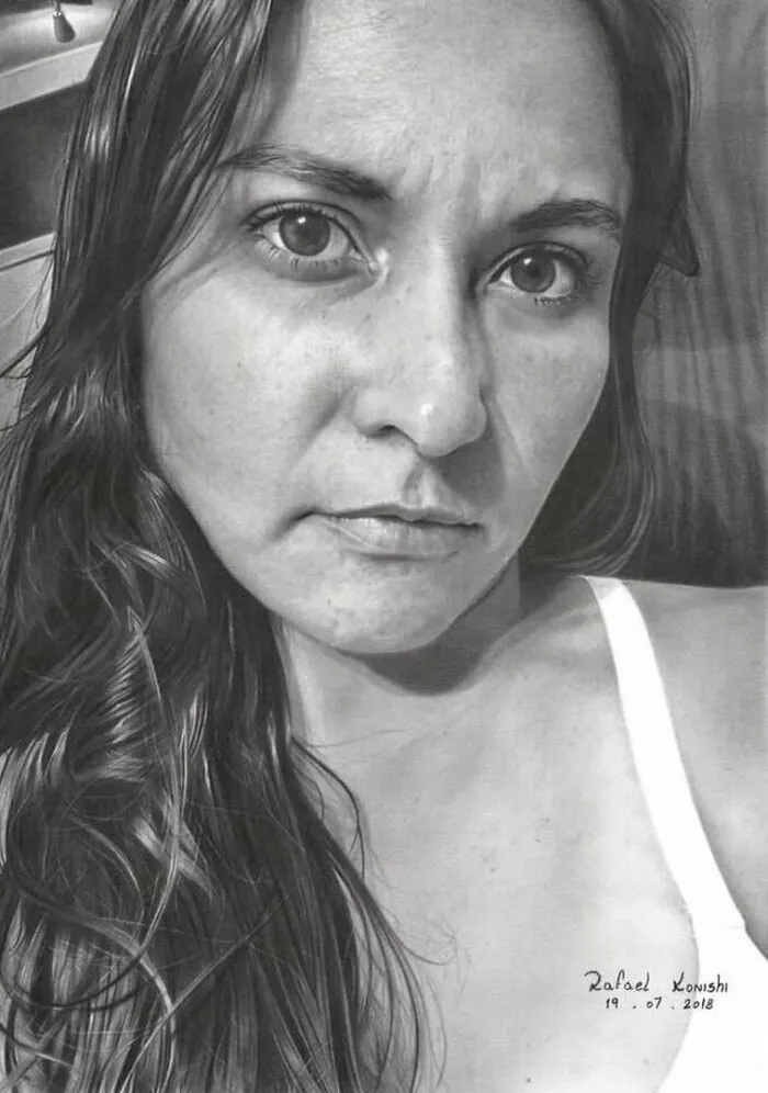 Realistic drawing by Rafael Konishi, depicting a woman's detailed facial features and flowing hair.