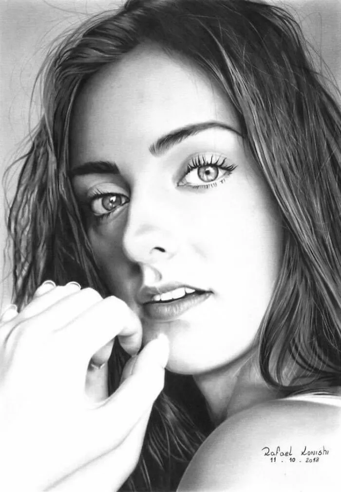 Realistic drawing of a woman by artist Rafael Konishi, showcasing detailed facial features and lifelike depth.