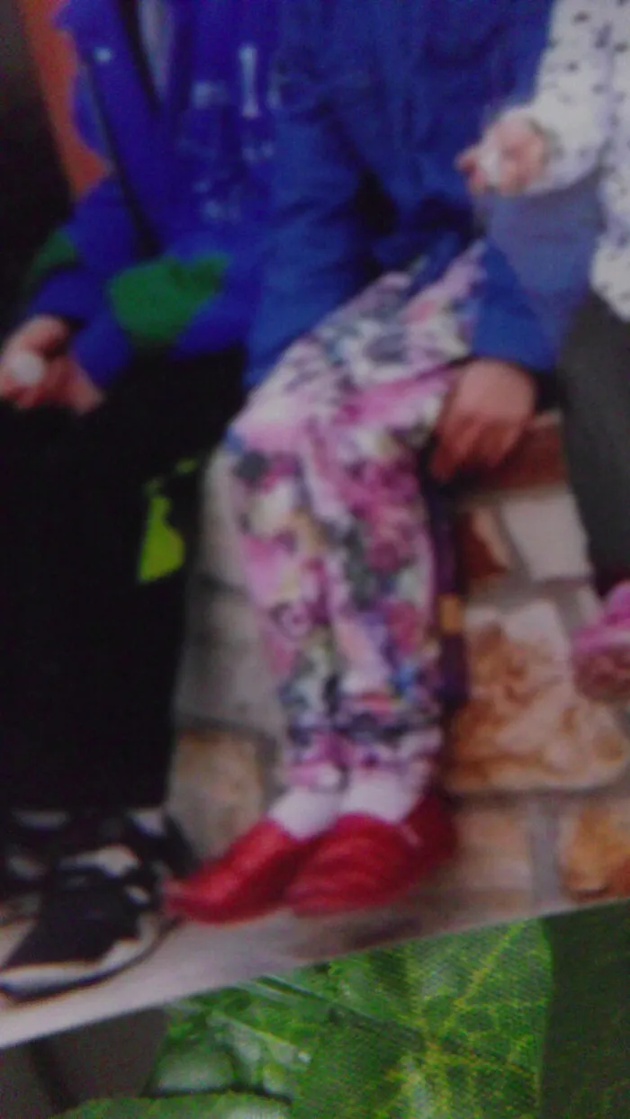 Sparkly Red Shoes, Floral Jeans, And A Flannel That Looks Like A Jean Jacket