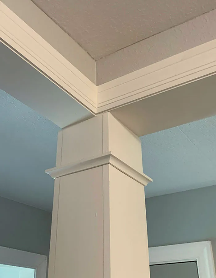 Awful home interior design with poorly aligned ceiling and wall panels.