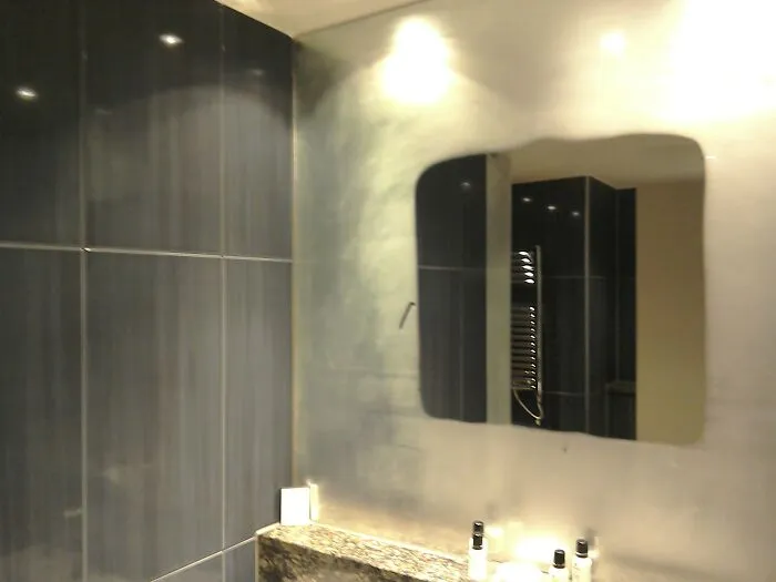 My Hotel Room Had A Heated Panel Behind The Bathroom Mirror To Stop It From Steaming Up After A Shower
