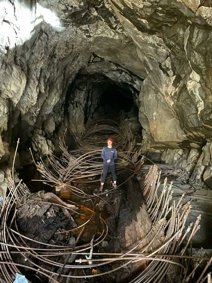 Found While Trail Running. What Are These Things? There's Rotten Wood That Goes Along It That Looks Cut/Altered By Man. Would It Be For Making A Flat Surface To Easily Maneuver The Mine?