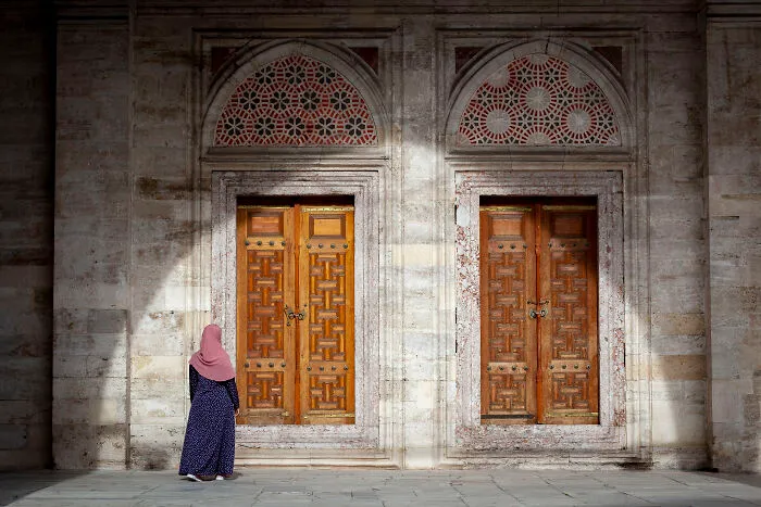 Photo Taken At The Courtyard Of The Suleymaniye Mosque. I Like The Shadow Of The Arch As A Frame And The Woman Walking Towards The Doors Create A Mystery