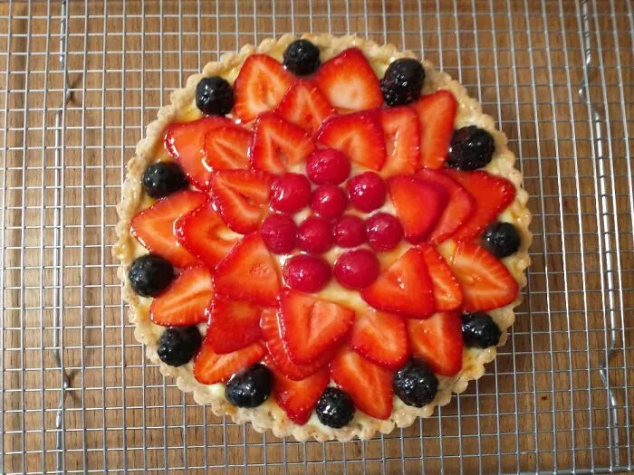 French Vanilla Pastry Cream Tart Topped With Berries And Apricot Glaze