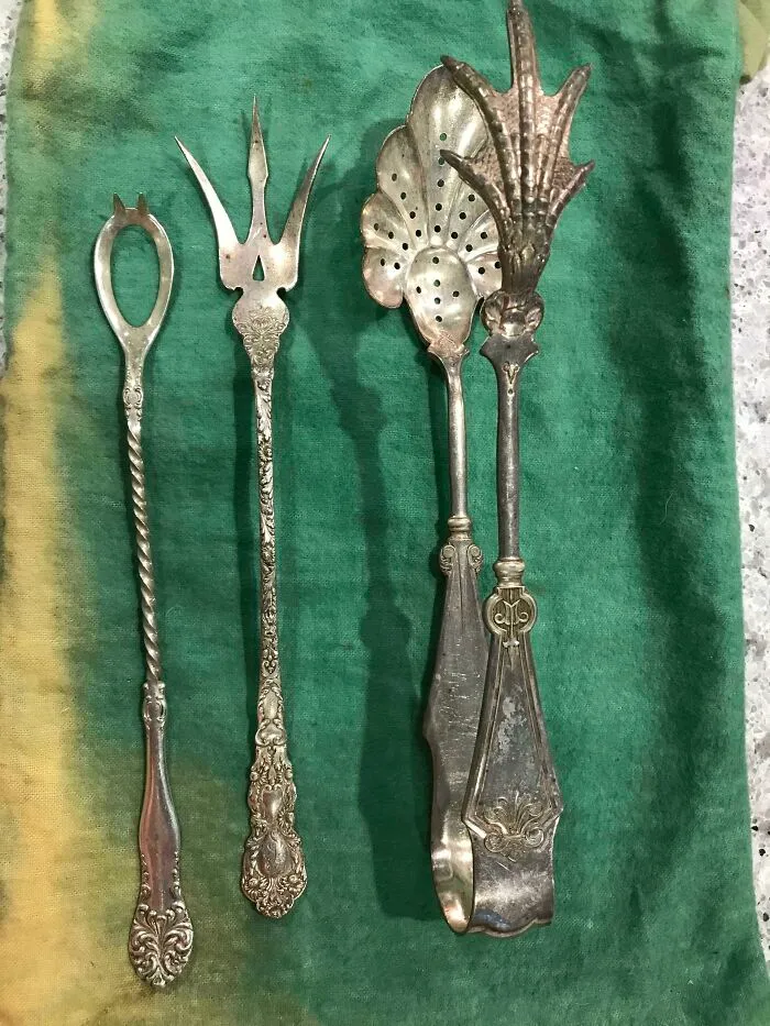 Open Spoon With Spikes; Trident-Like Fork; Tongs With A Chicken Foot And A Perforated Spoon. All Antique Silver