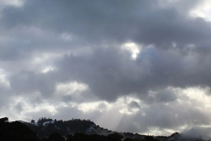 Cloudy Day With Snow On The Hills