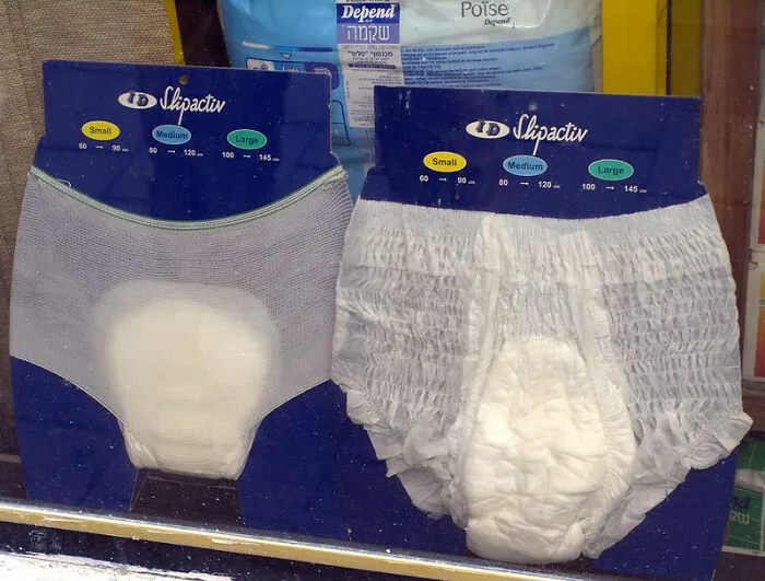 Adult diapers displayed in a Japanese store window, showcasing unique aspects of Japan.