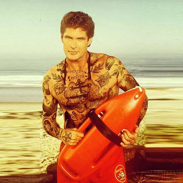 Man with tattoos photoshopped on him, holding a red lifeguard float, standing on a beach.