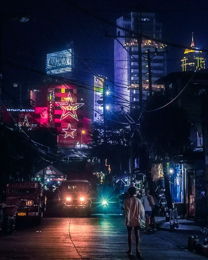 Another Dark Street Scene In Guadalupe. Slums Juxtaposed Against The Neon Skyscrapers Of Makati And Bgc