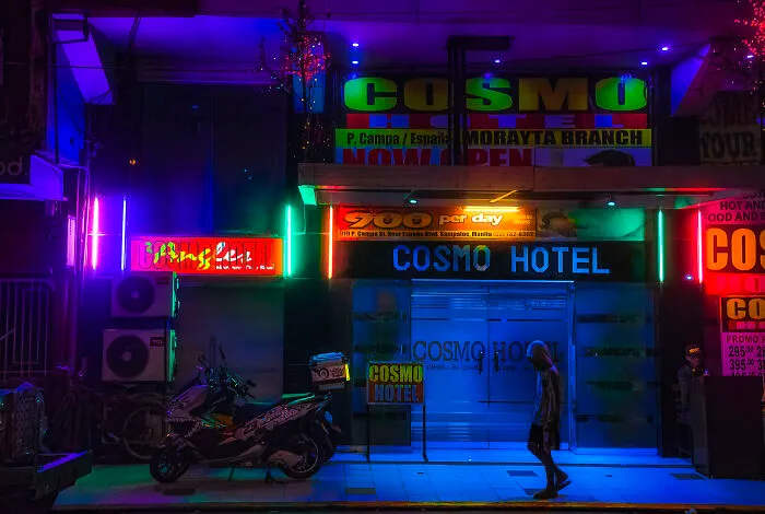 A Neon-Lit Budget Short-Stay Hotel In Sampaloc, Manila. You Can Tell That It's Good Biz Around Here Because Our Family-Centric Filipino Culture Expects Adults To Stay In Their Families' Homes Even After They Finish Their Schooling, Which Explains The Demand For No-Tell-Motels Like This