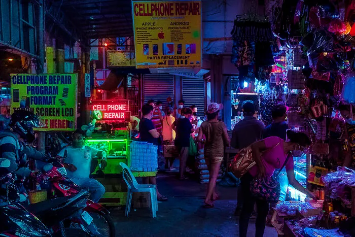 A Busy Night At Muntinlupa's South Empire Market. Gadget Chop Shops Are Everywhere