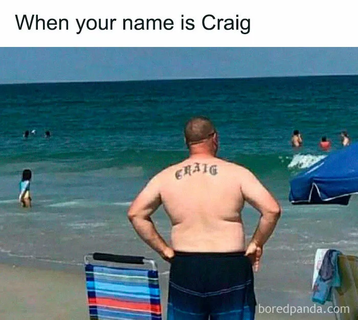 Man with "CRAIG" tattoo on his back stands shirtless at the beach, illustrating a literal meme.