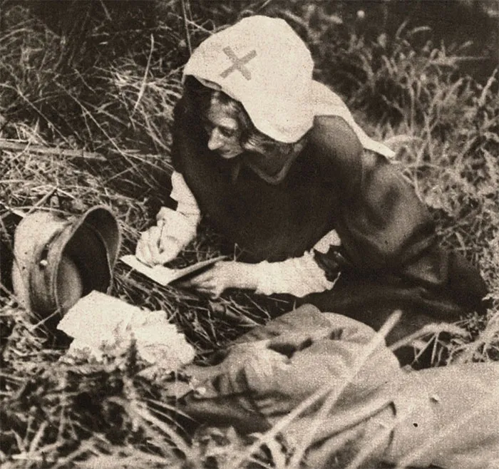 A Red Cross Nurse Writing Down Last Words Of Mortally Wounded Soldier, Taken Around 1917