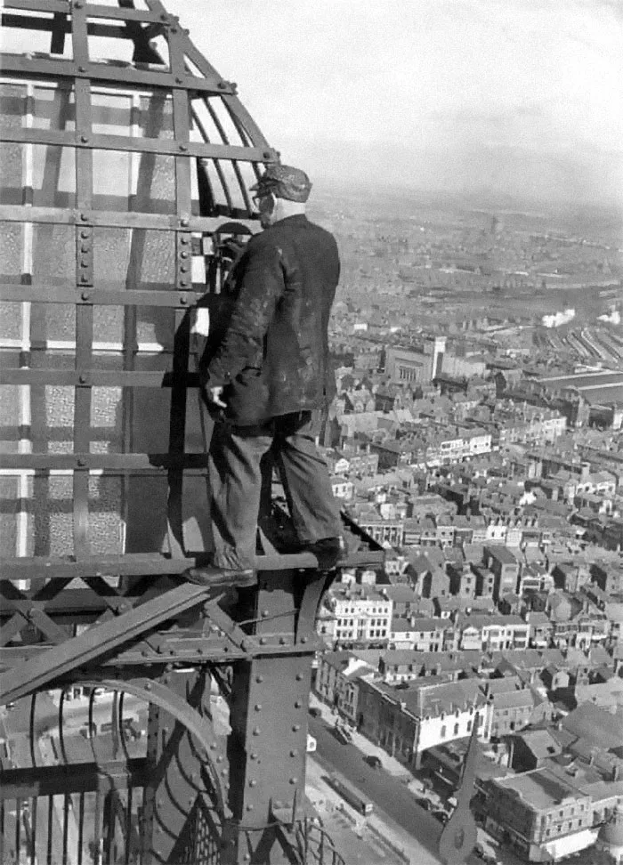 No Health And Safety Back In The Day. Guy Painting Blackpool Tower In The UK