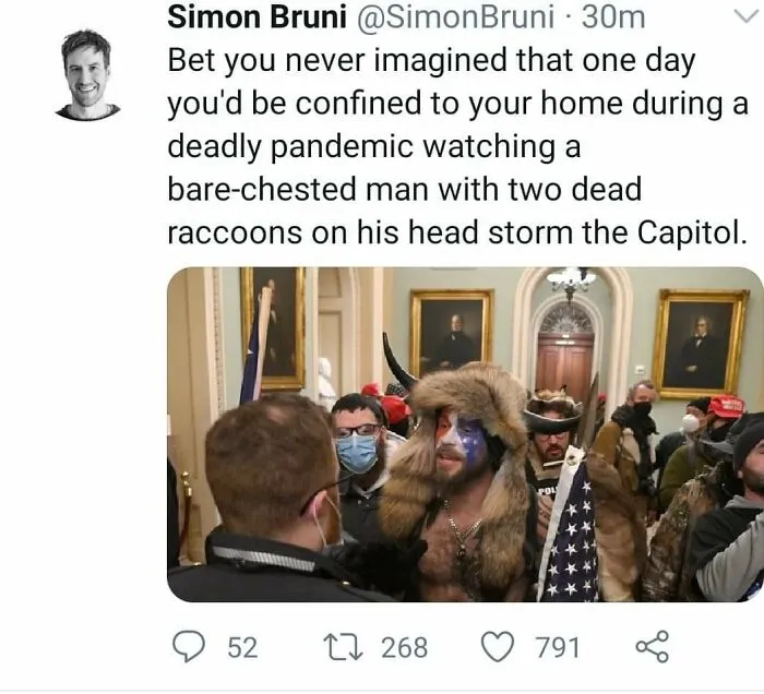 Bare-Chested Man With Two Dead Raccoons