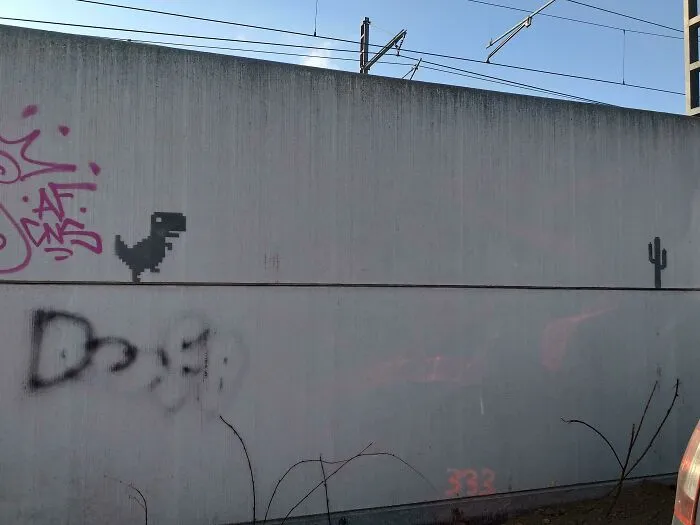 T-Rex Runner Near Some Train Tracks