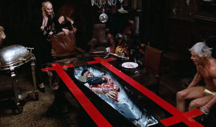 In The Rocky Horror Picture Show (1975), When A Corpse Is Revealed Under The Dining Table, The Actors Were Genuinely Shocked. None Of Them Knew That The Body Was There – With One Exception, Tim Curry, Because He Was The One Who Had To Whip The Tablecloth Off