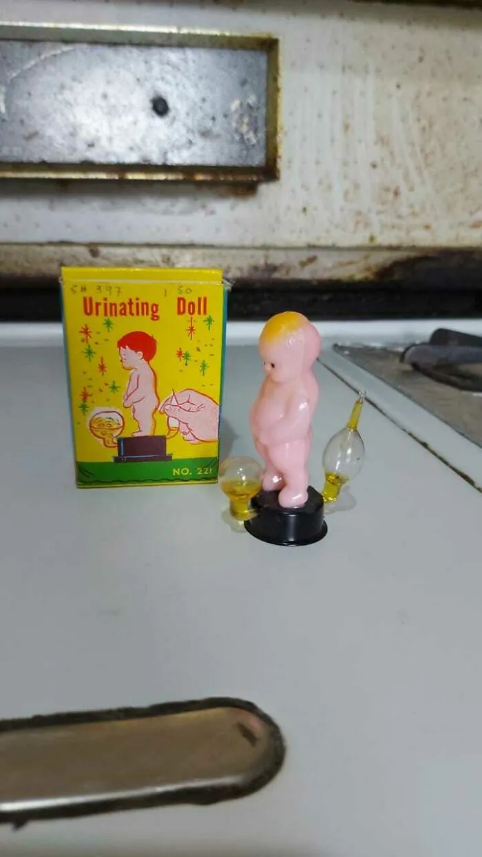 Urinating Doll: I Found This While Helping My Father Spring Cleaning. I Decided To Keep It. When You Touch The Glass Bubble At The Back, The One In The Front Starts Filling In