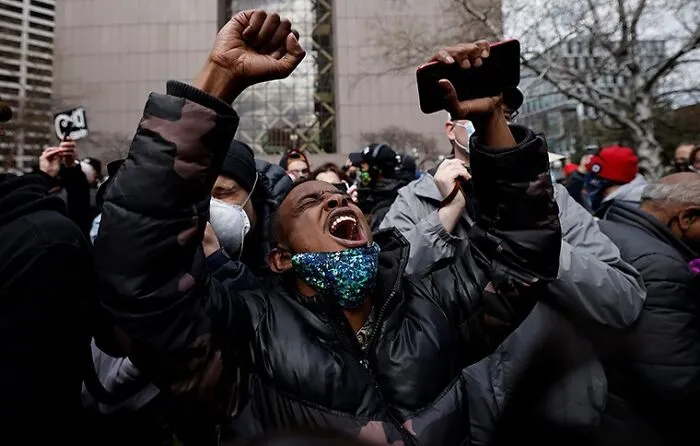A Man Outside Of The Courthouse Learns That Derek Chauvin Was Found Guilty On All Three Counts