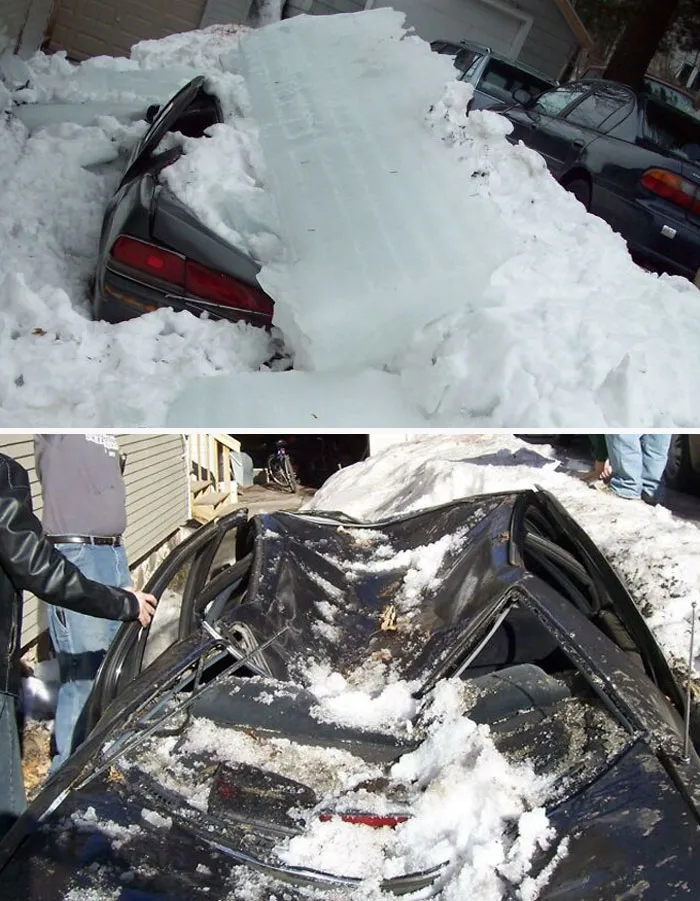 Car crushed by large chunks of ice and snow in a residential driveway showing nature made people go well that sucks moment.