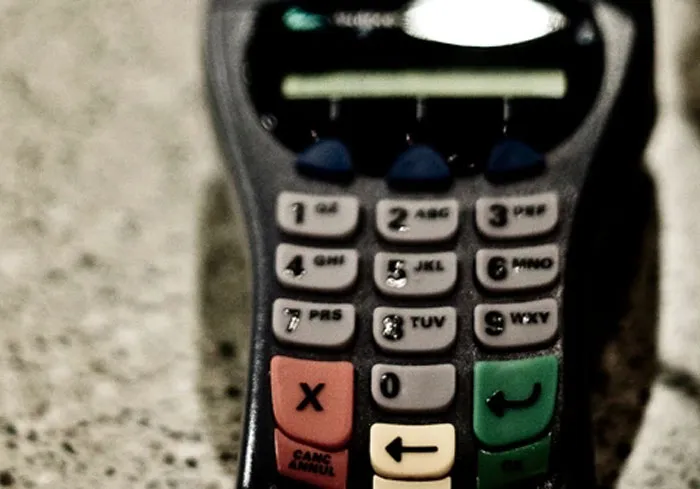 Close-up of an old calculator keypad with number buttons, showcasing interesting facts about vintage technology devices.