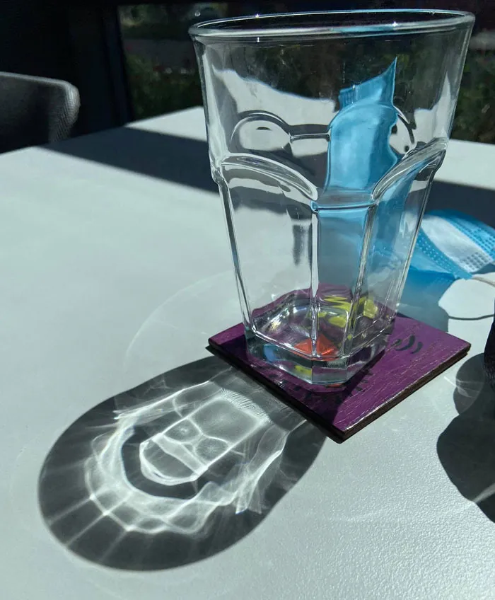 Sun's Reflection On My Drinking Glass Creates Bart Simpson’s Skull