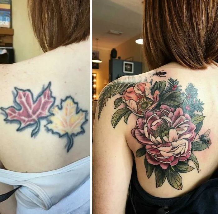 Tattoo cover-up showing floral design over old leaf tattoos on a person's back.