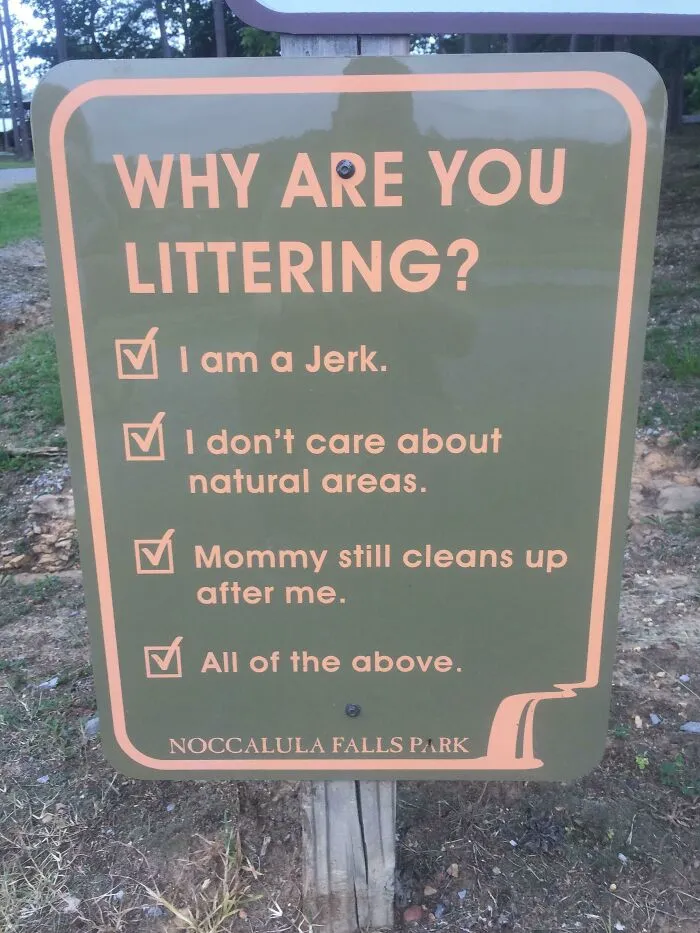 Funny sign at Noccalula Falls Park asking "Why are you littering?" with humorous checkbox options.