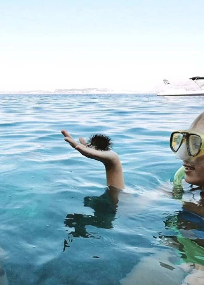 Man With Curly Hair About To Dive Into The Water
