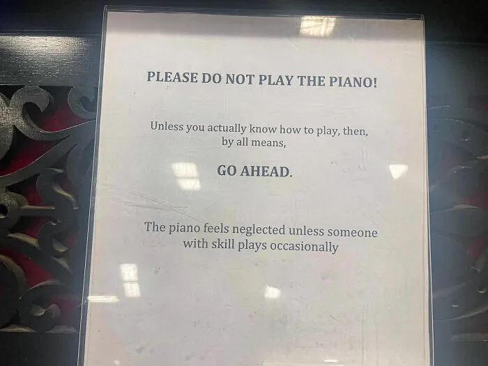 Funny sign humorously encouraging skilled piano players to play.