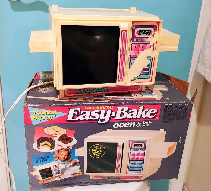 Vintage Easy-Bake Oven toy from the '70s, showcased with its original packaging.