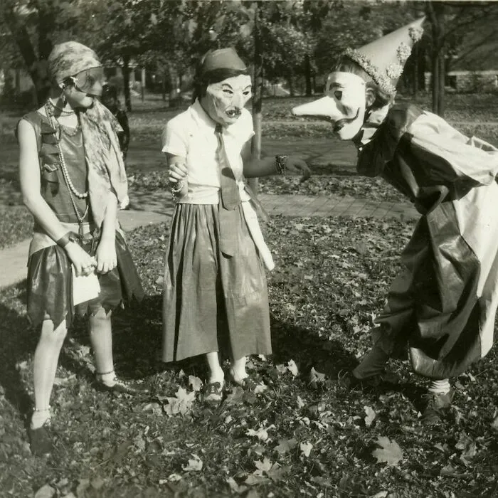 Three Girls In Masked Costumes At Halloween Festivities In College Hill, Cincinnati, Ohio In 1929